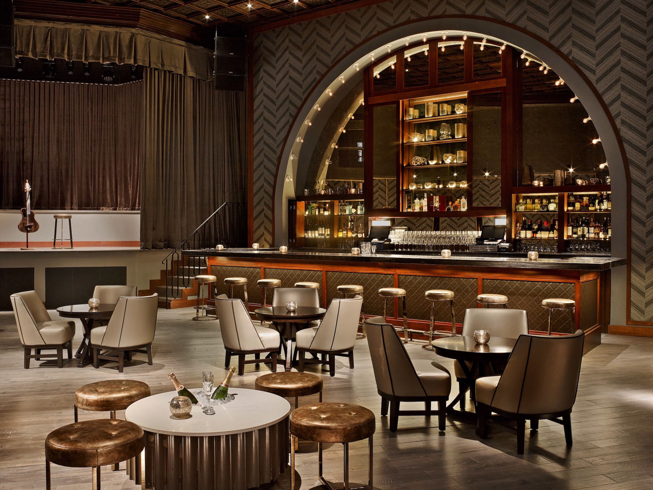 bar with seating and a stage for live entertainment