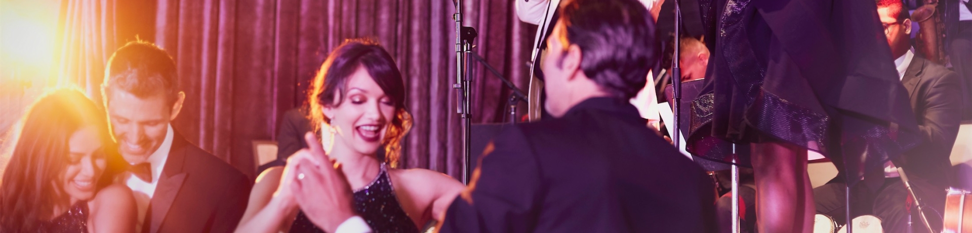 performers playing music while people dance