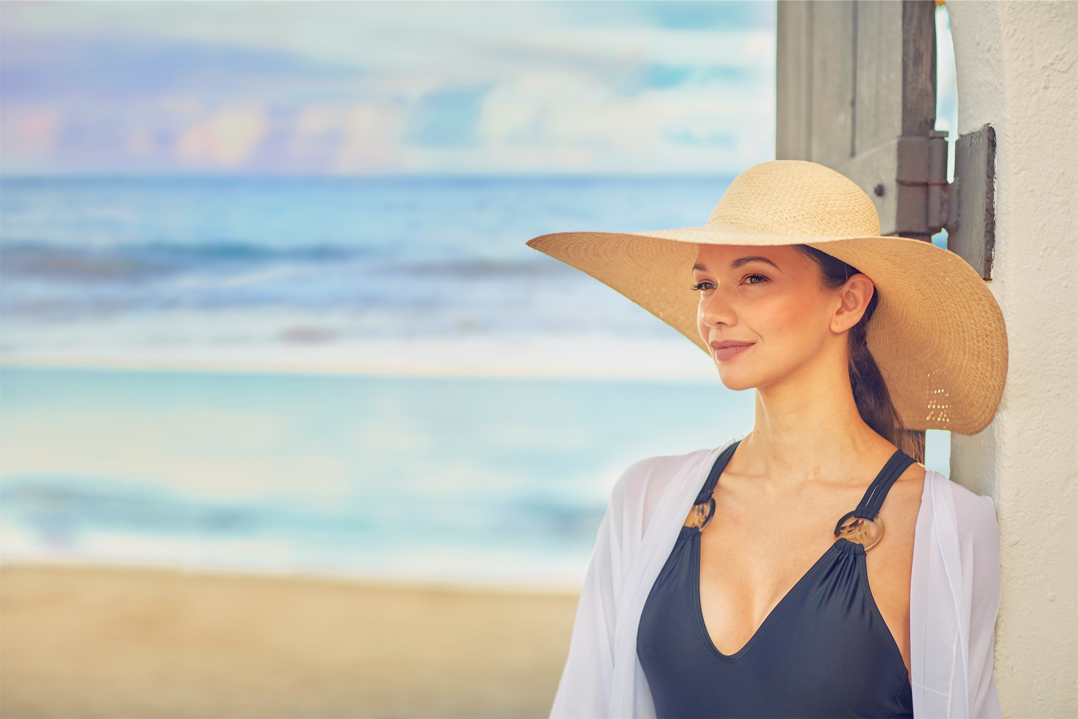 woman in a hat on the beach