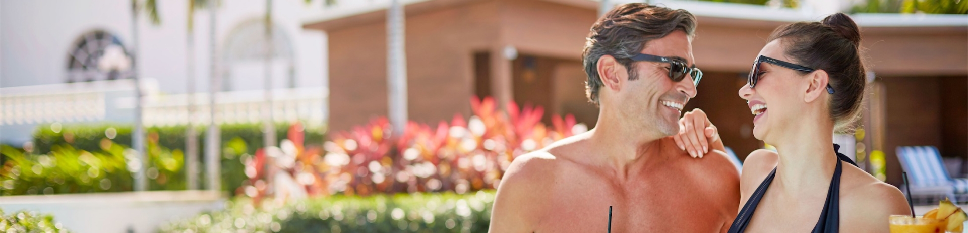 a couple drinking in the pool