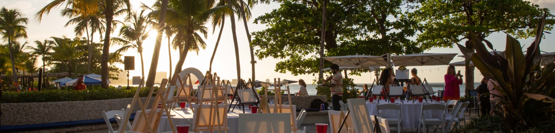 outdoor venue with round tables set up for a paint night