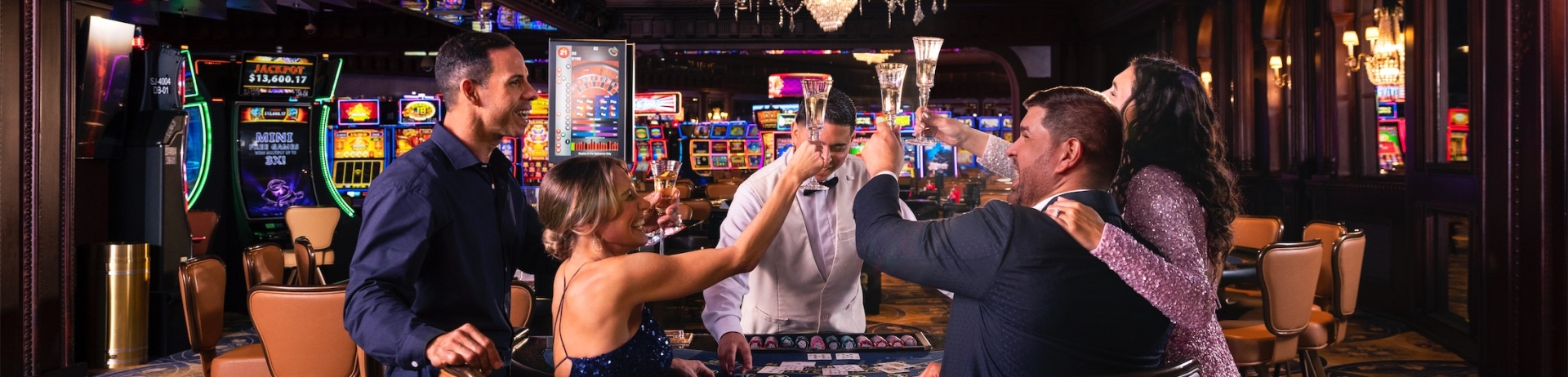 friends cheering while playing cards