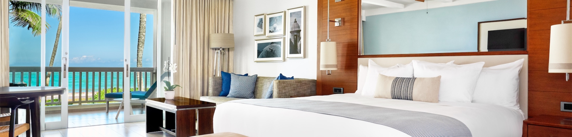 king sized bed in a room with a large mirror