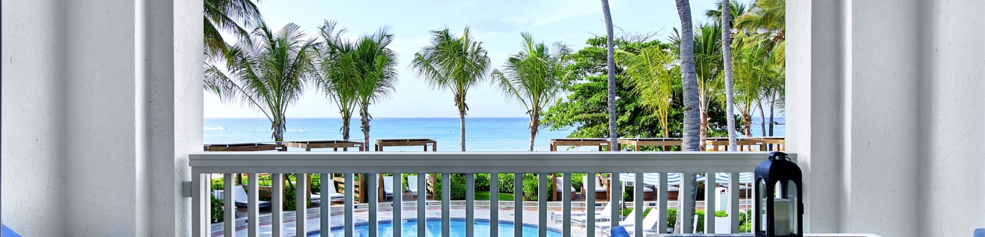 bolcony lounge area overlooking a pool