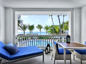 bolcony lounge area overlooking a pool