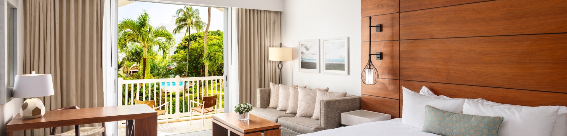 hotel room with a king sized bed and balcony