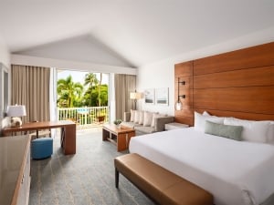 hotel room with a king sized bed and balcony