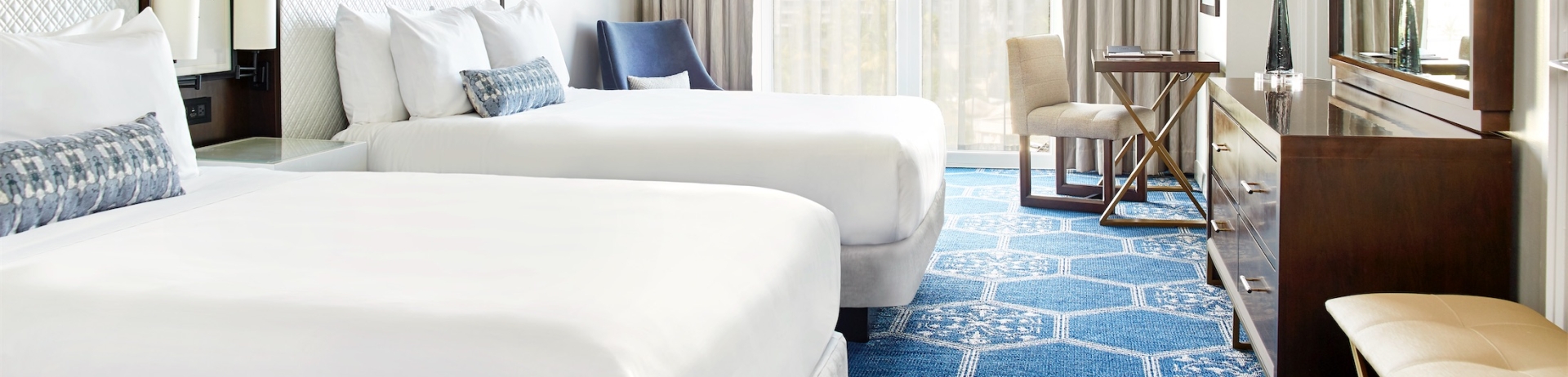 two queen sized beds in a hotel room