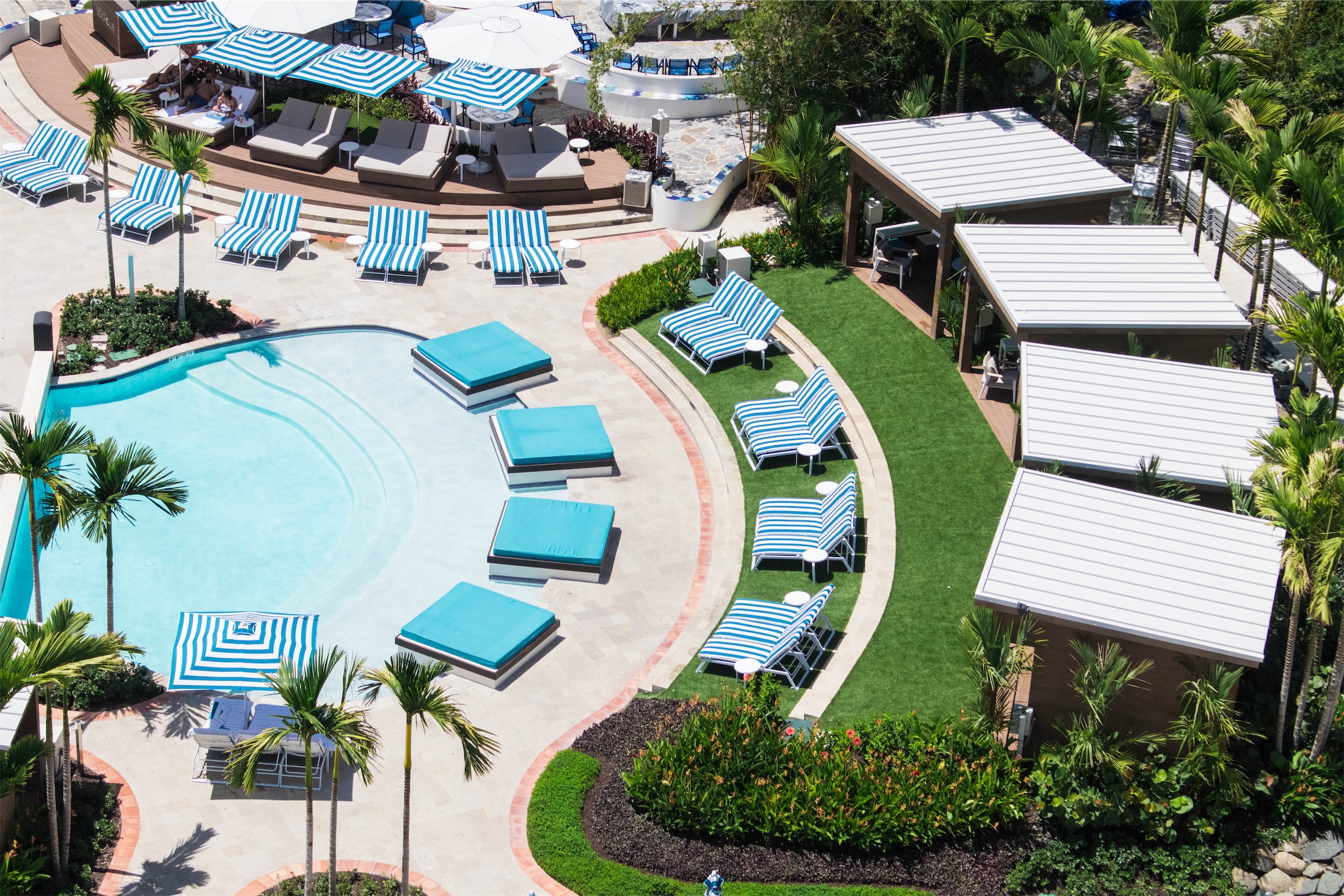 aerial view of a pool and outdoor lounge area