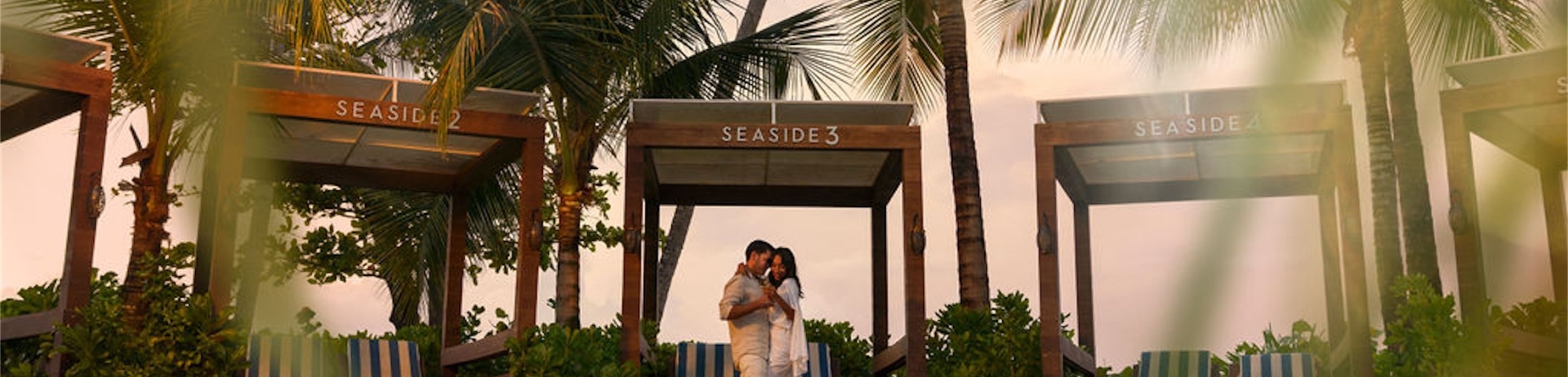 couple standing together by a pool