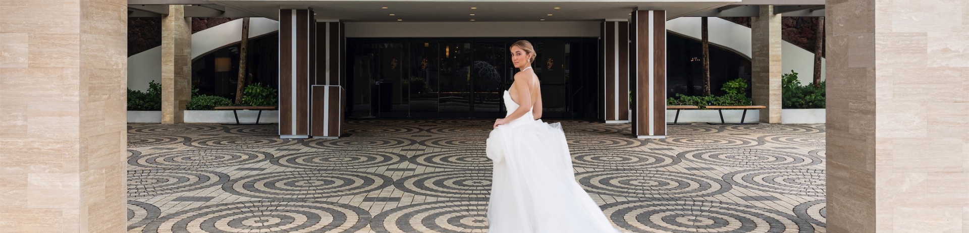 woman in a wedding dress entering el san juan hotel