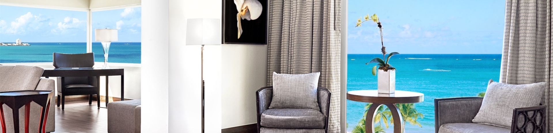 suite with sitting area overlooking the ocean