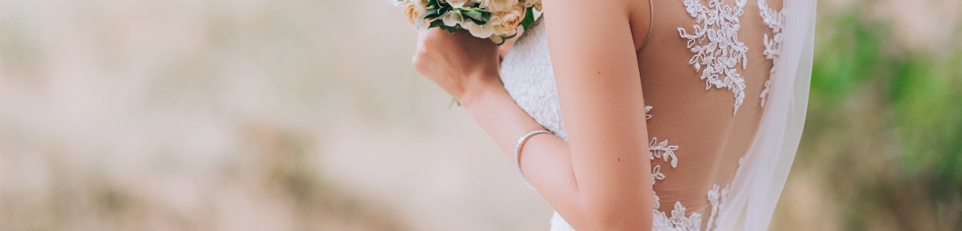 woman wearing a wedding dress and holding a bouquet