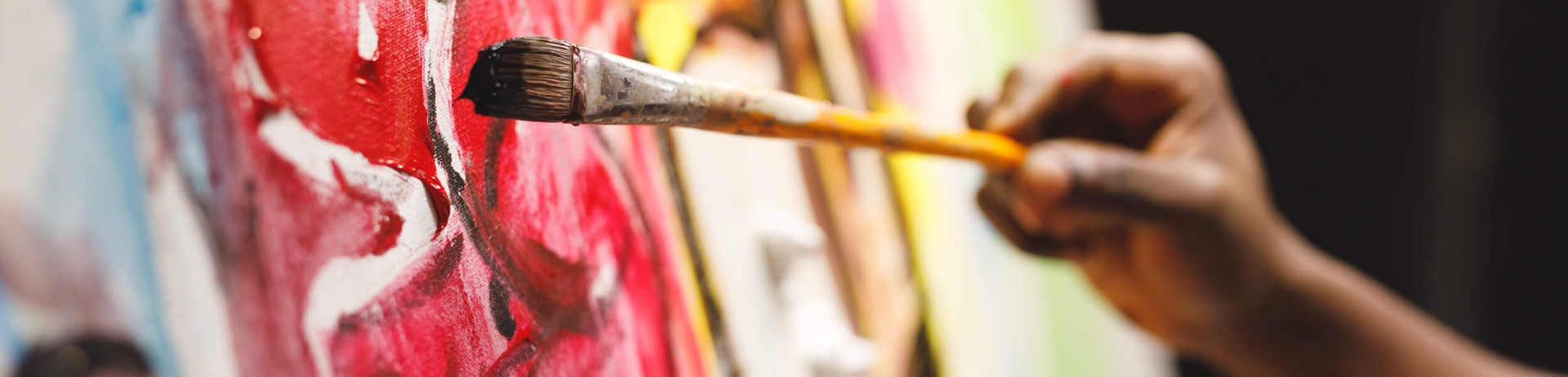 paintbrush painting a canvas